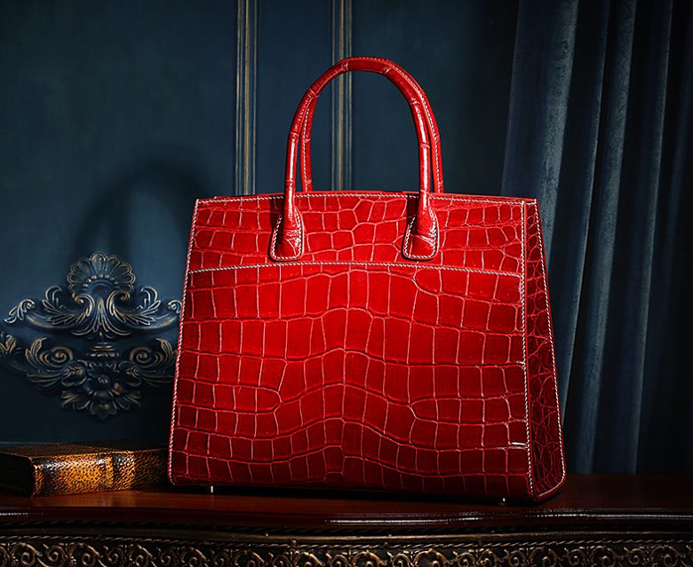 Red alligator leather handbag